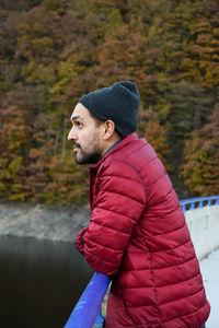 Young man sitting outdoors