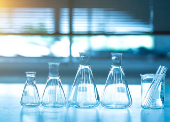 Close-up of laboratory glassware on table