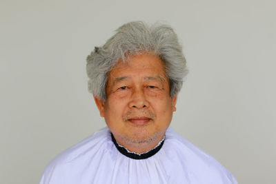 Portrait of man against white background