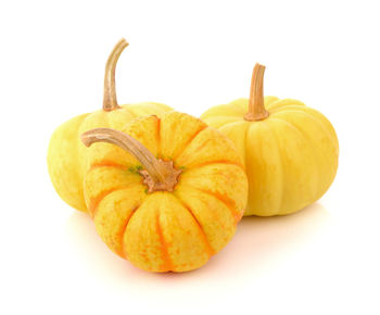 Close-up of pumpkins against white background