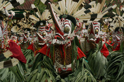 The scene of hudoq dancers marching in order to perform sacred rituals.