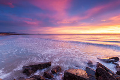 Scenic view of sea against sky during sunset