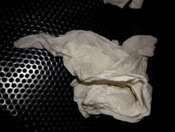 High angle view of metal on table against black background