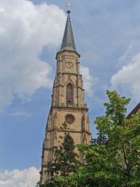 Low angle view of clock tower against sky