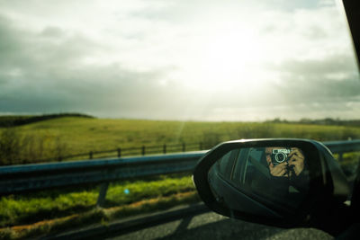 Reflection of road on side-view mirror