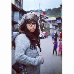 Young woman standing on street