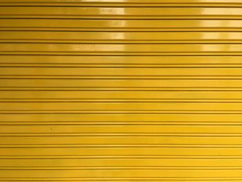 Full frame shot of closed yellow shutter