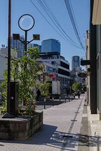 Street amidst buildings against sky