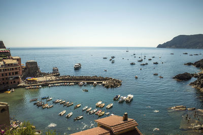 High angle view of boats in sea against sky