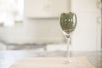 Close-up of wineglass on table