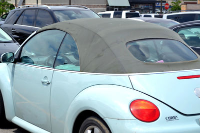 Close-up of vintage car on street