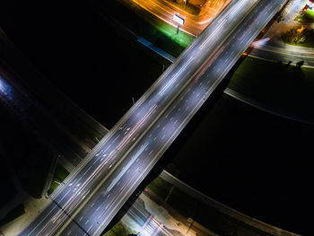 Light trails on road in city at night