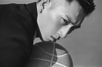 Close-up portrait of young man looking away