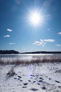 Scenic view of frozen lake against sky