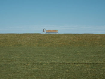 Built structure on field against clear sky