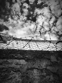 Barbed wire against sky