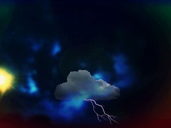 Low angle view of illuminated blue sky at night