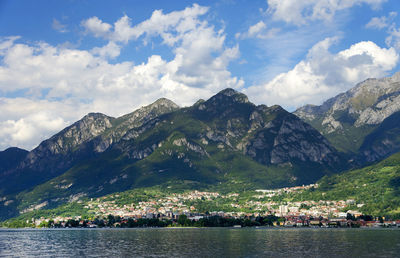 Calm lake with landscape against the sky