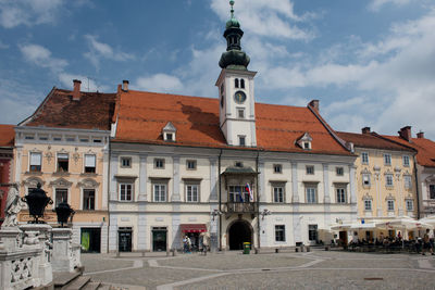 View of buildings in town against sky