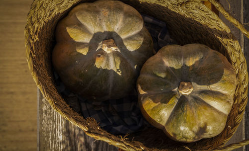 High angle view of two pumpkins in basket