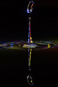 Close-up of water splashing against black background