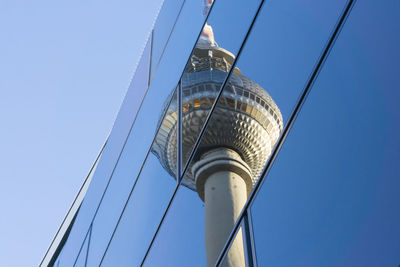 Reflection of fernsehturm on office building