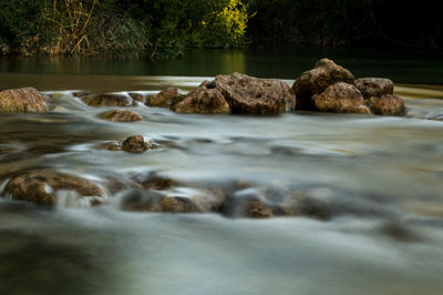 Surface level of water flowing over rocks