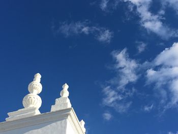 Low angle view of built structure against blue sky