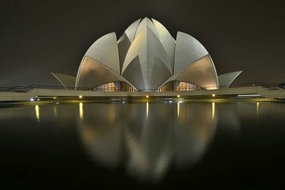 Reflection of illuminated building in water