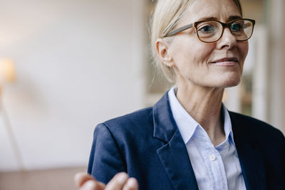 Portrait of confident businesswoman wearing glasses