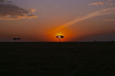 Scenic view of silhouette land against sky during sunset