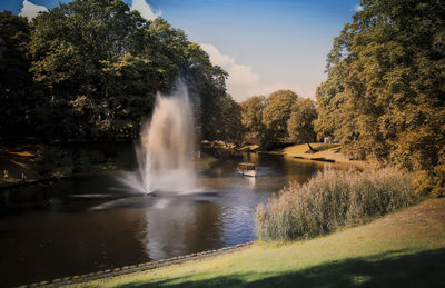 View of waterfall in city canal in riga latvia 