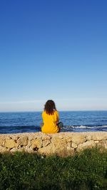 Scenic view of sea against blue sky