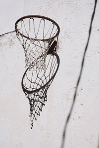 Low angle view of basketball hoop against wall