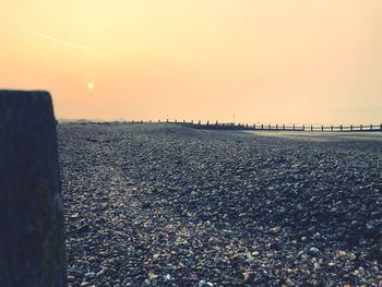 Scenic view of sea against clear sky during sunset