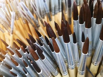 High angle view of paintbrushes in container