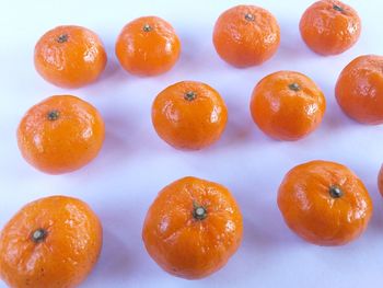 High angle view of orange fruits on table