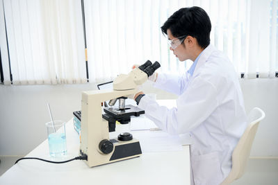 Doctor examining chemical in laboratory