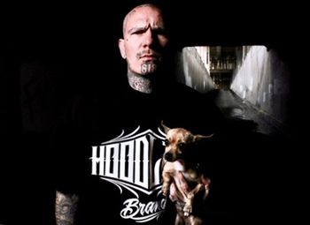 Portrait of man with dog at home