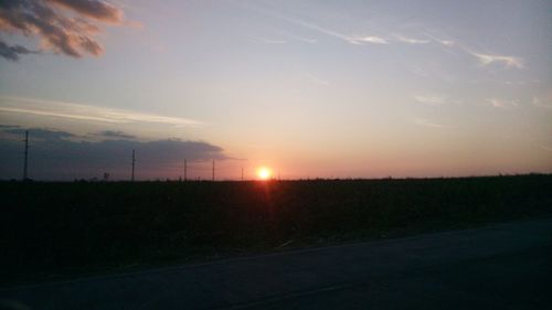 Scenic view of landscape at sunset