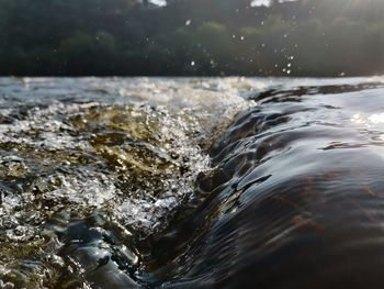 Close-up of water splashing in sea