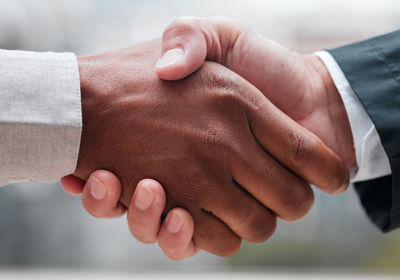 Cropped image of couple holding hands