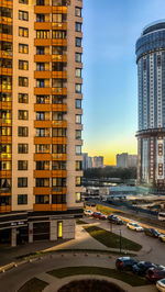 City street and buildings against sky