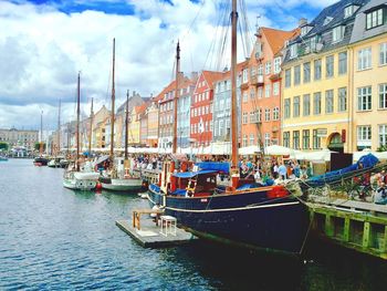 Boats moored at dock