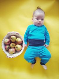 Cute boy with fruits