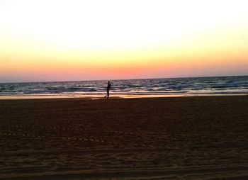 Scenic view of sea at sunset