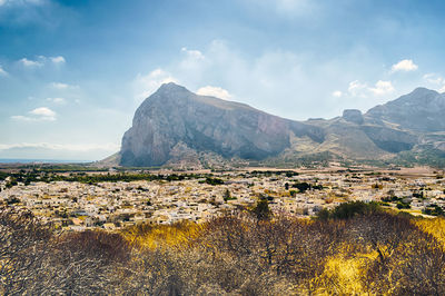 Scenic view of landscape and mountains against sky