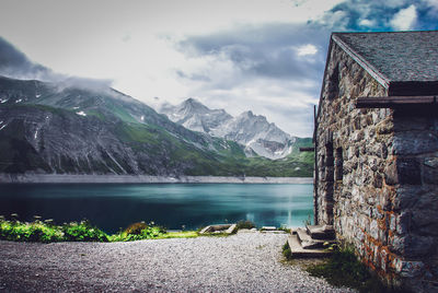 Scenic view of lake and mountains against sky