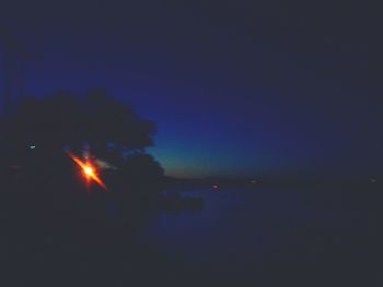 Scenic view of landscape against sky at night