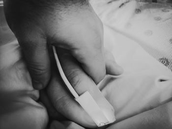 Close-up of person holding hands